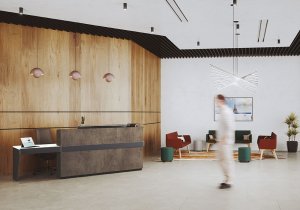 Photo d'inspiration de l'aménagement d'un accueil d'entreprise moderne et confortable grâce à l'utilisation d'une banque d'accueil de modèle "Atlas" et de canapés pour la salle d'attente.